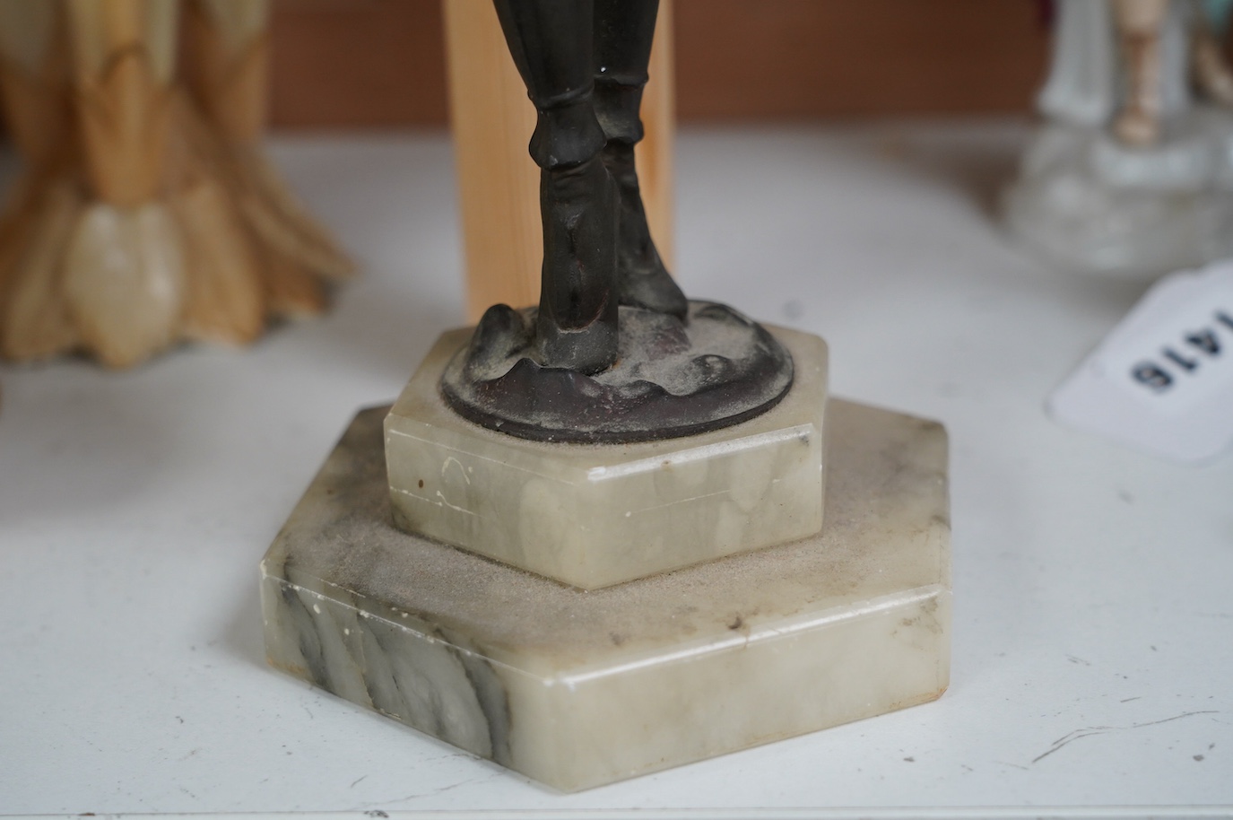 An Art Deco resin and patinated spelter model of a dancer on onyx base, 30cm. Condition - poor